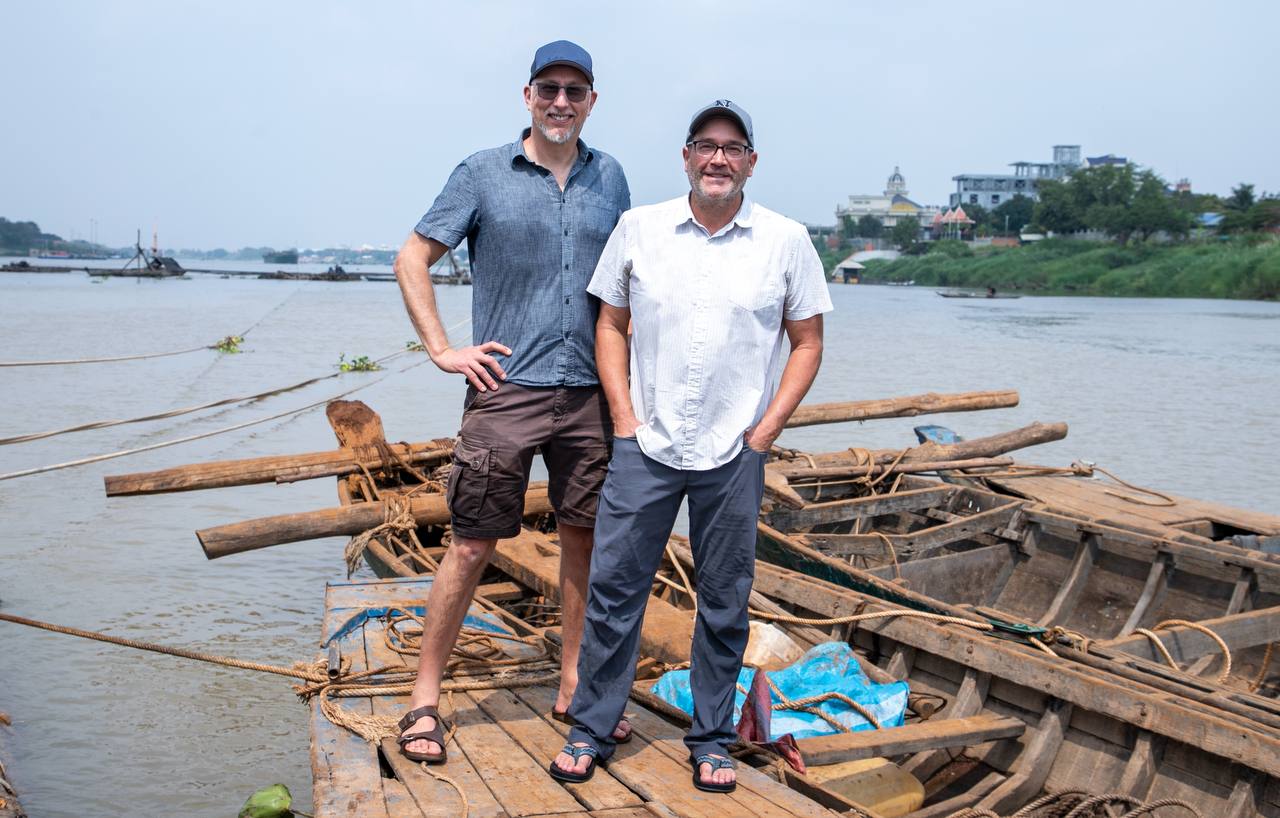 Stefan Lovgren and Zeb Hogan on the Tonle Sap River in Phnom Penh